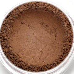 Eyeshadow powder, matte dark brown color, close-up view in clear jar