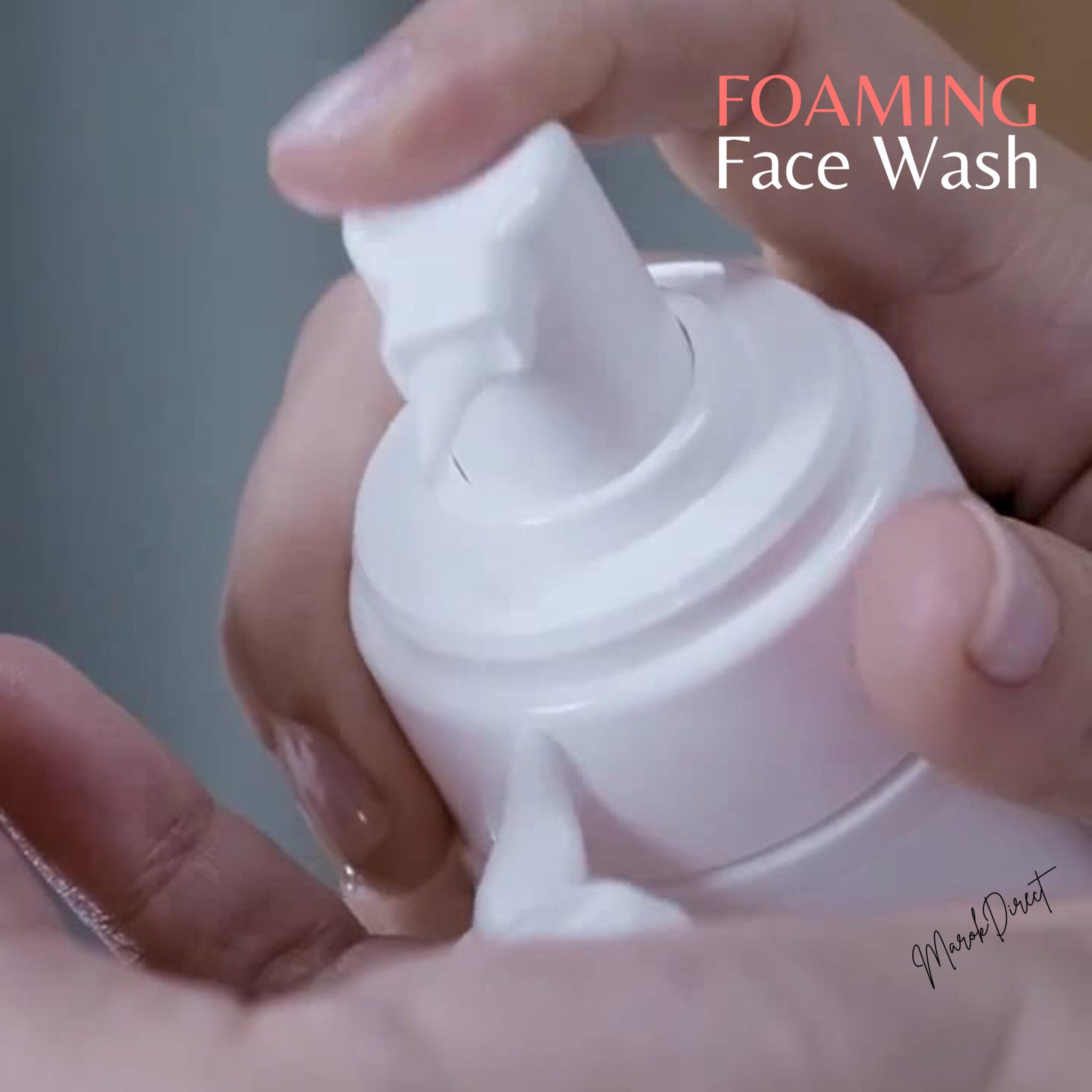 Foaming face wash dispenser, white plastic bottle, dispensing white foam