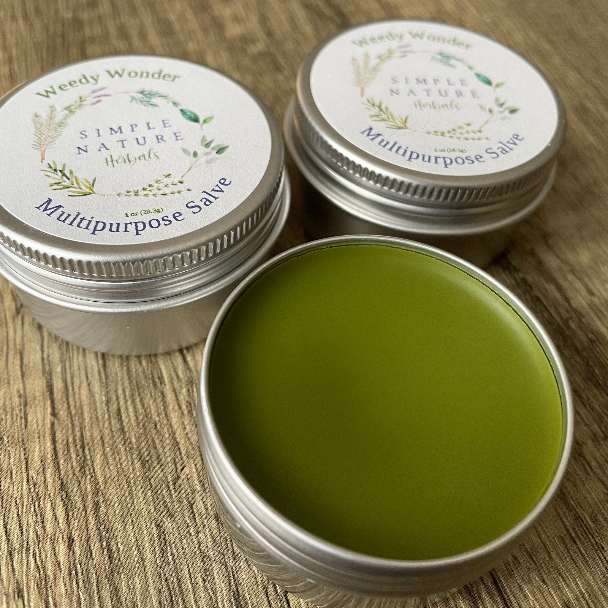 Multipurpose salve in silver tins with green salve, Simple Nature Herbals branding visible on lids