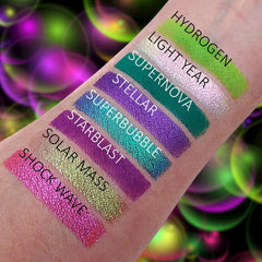 Side view of Cosmic Bubbles Eyeshadow Palette showing 12 vibrant matte and shimmer shades in circular pans
