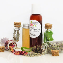 Toner bottles with brown liquid, glass jars with corks, and plant ingredients, JBHomemade label