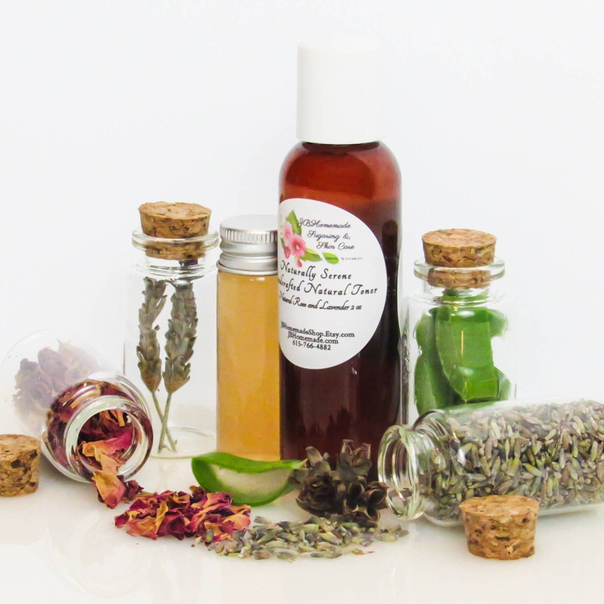 Toner bottles with corks and clear glass, surrounded by botanicals and herbs