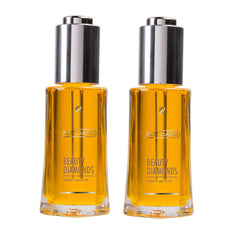 Beauty oil bottles with silver cap, yellow liquid, and "BEAUTY DIAMONDS" text