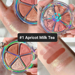 Eye makeup palette with pink, gold, and brown eyeshadows in a circular case, MAFFICK brand visible