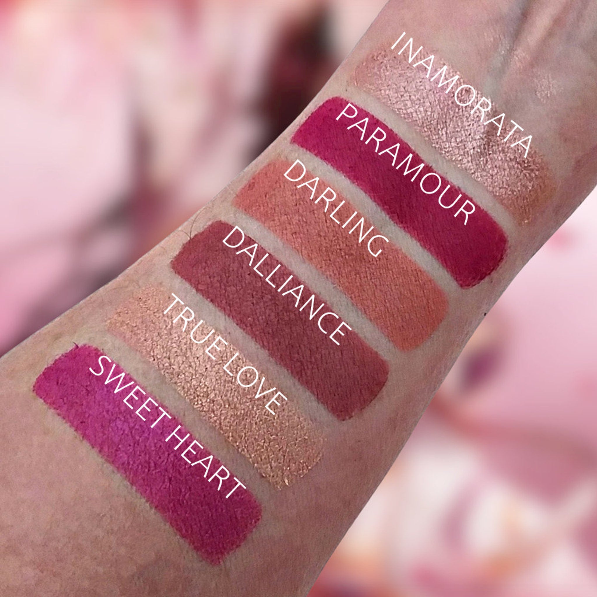Lipstick swatches in pink, red, and gold shades on skin, with product names visible