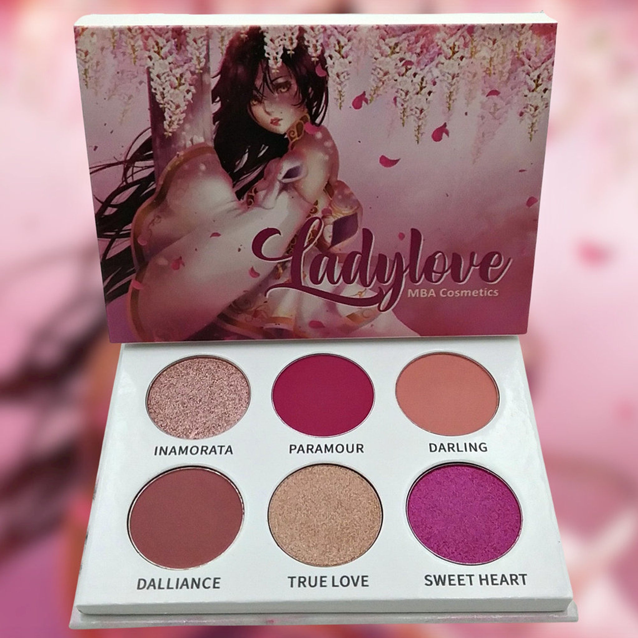 Eyeshadow palette with pink and purple shades, white packaging, "Ladylove" brand name