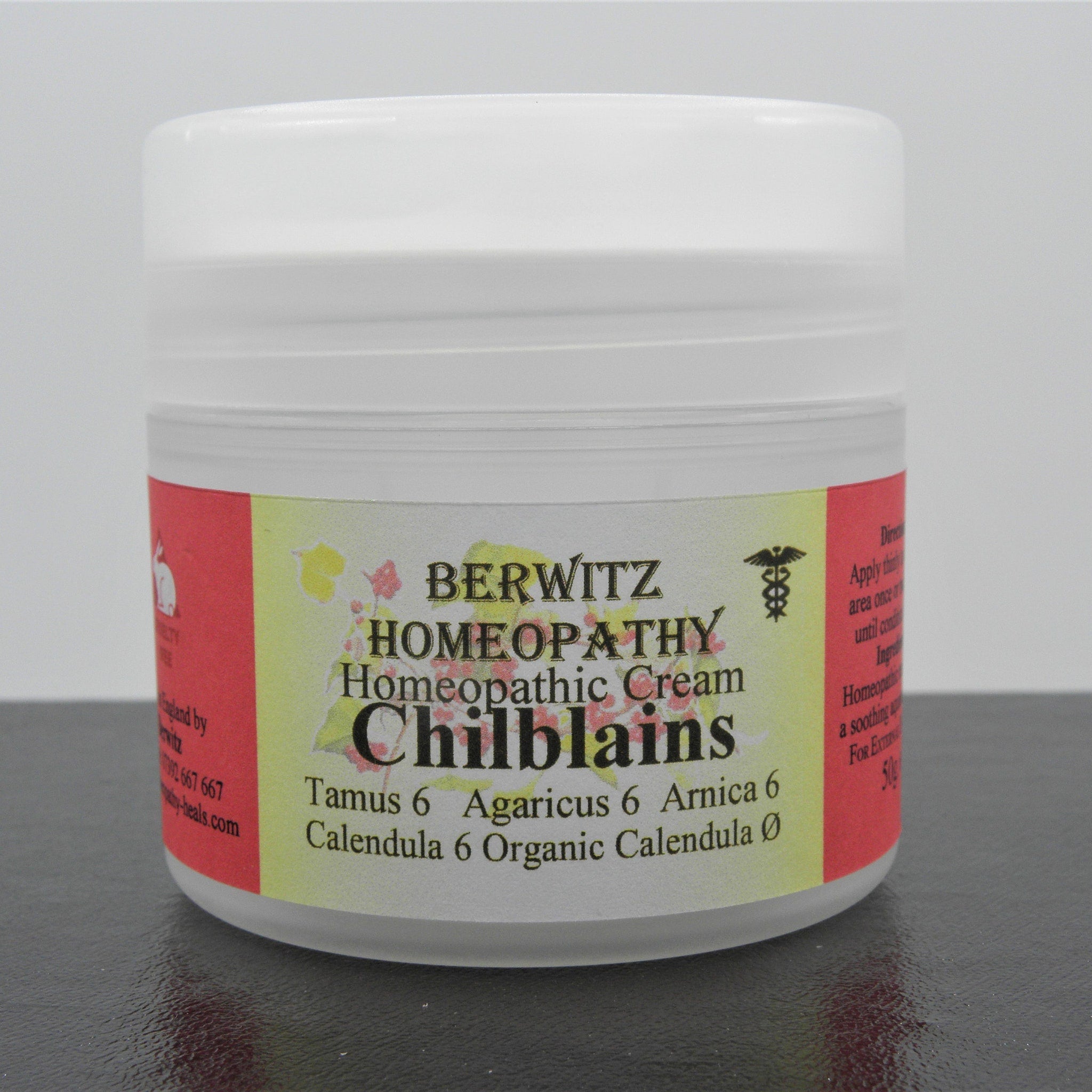 Chilblains Homeopathy Cream white plastic jar with red and yellow label, Berwitz Homeopathy brand