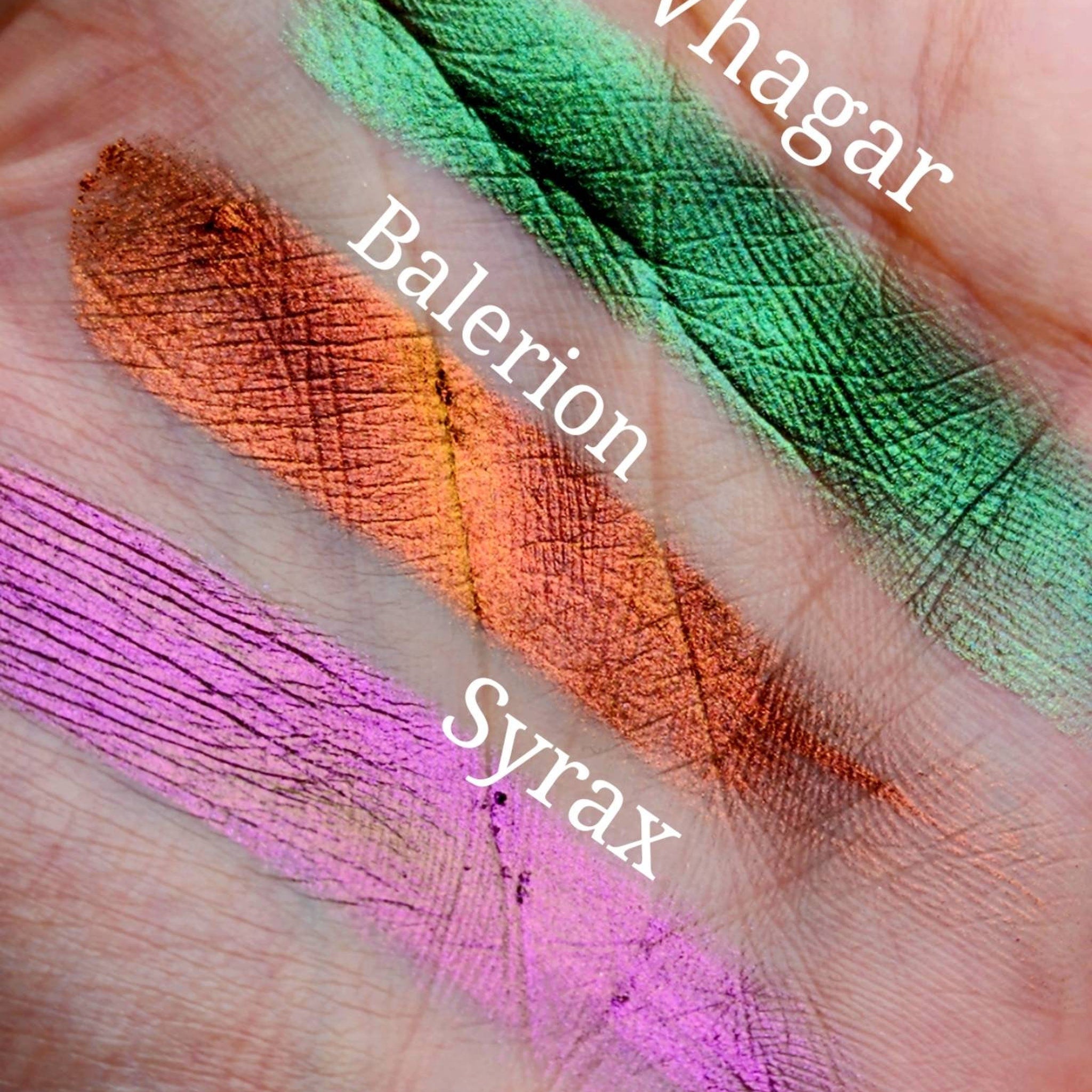 Eyeshadow swatches, green, orange, and purple metallic shades on skin, with text labels