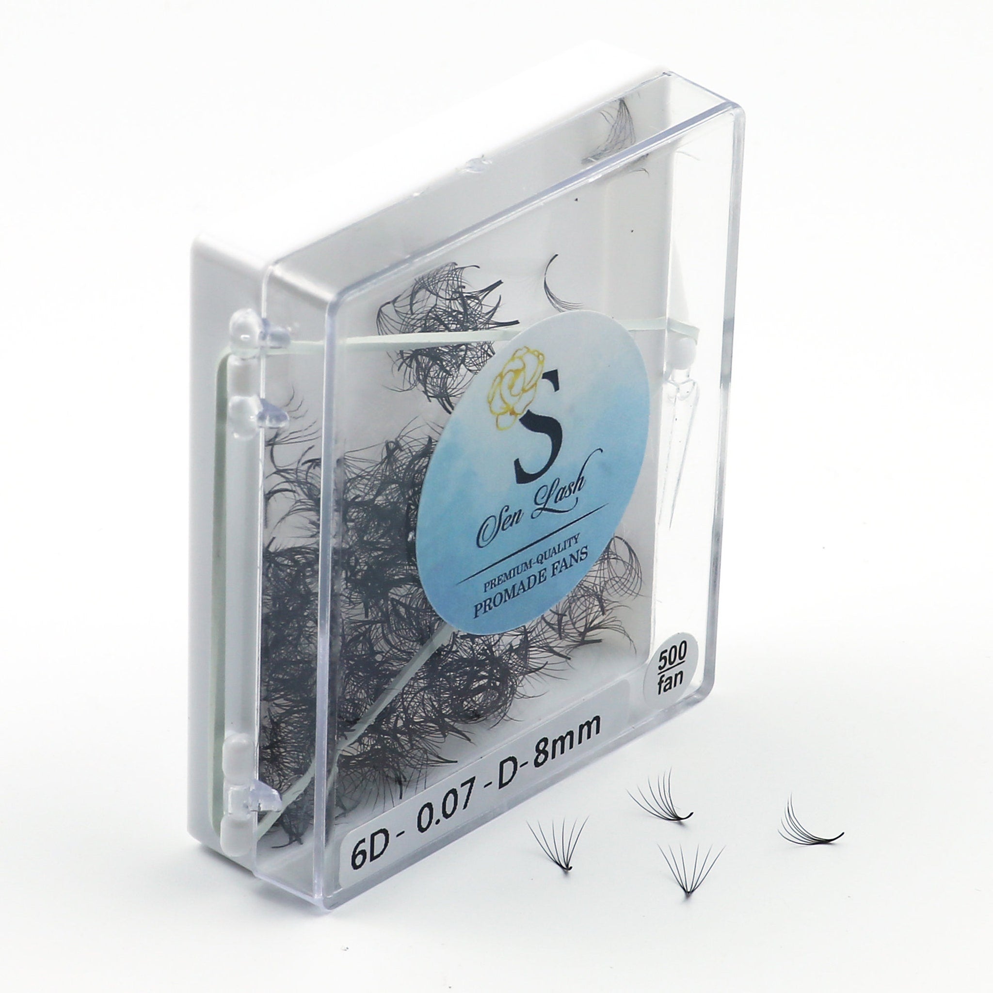Eyelash extensions in a clear plastic container with black lashes and Sen Lash logo visible