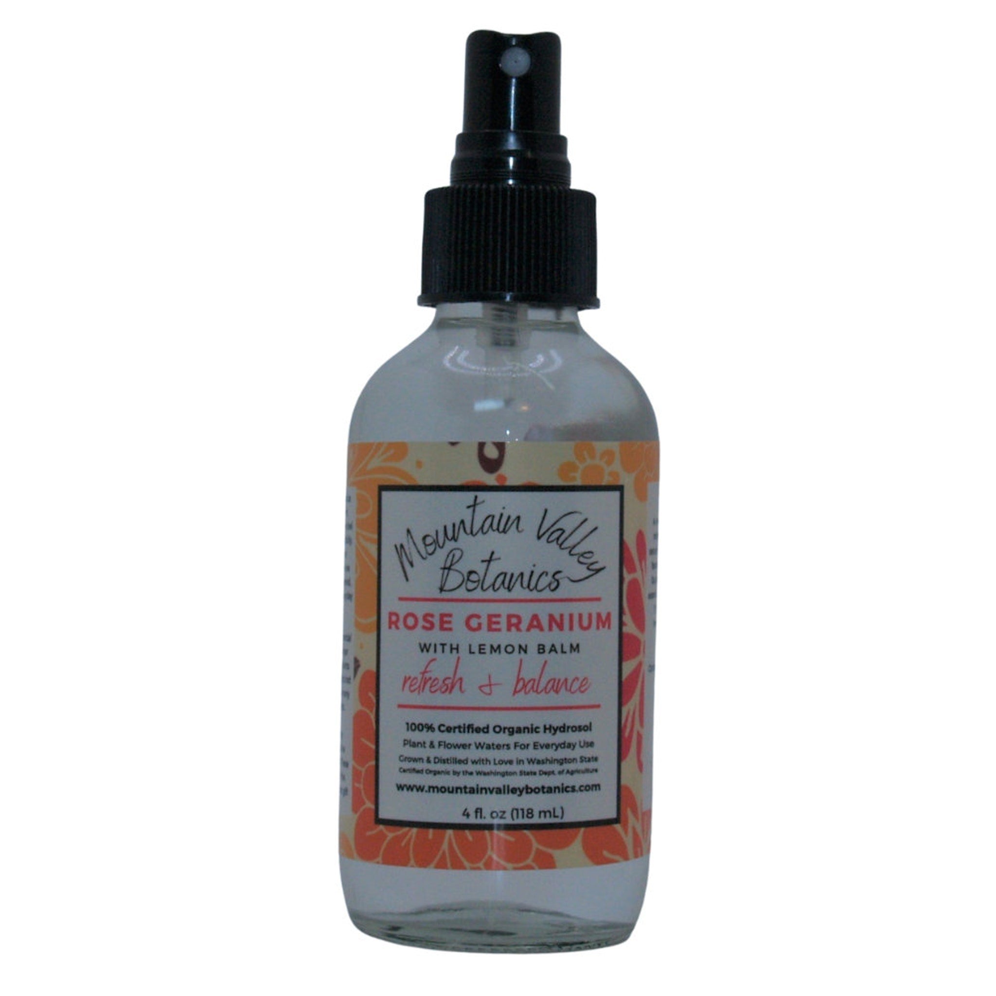 Rose Geranium hydrosol spray bottle, clear glass, black spray top, Mountain Valley Botanics label
