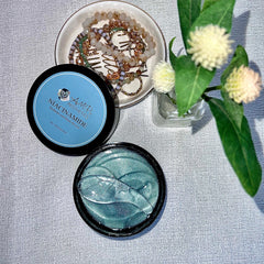 Close-up of translucent hydrating eye jelly mask with cooling gel texture in sleek silver packaging