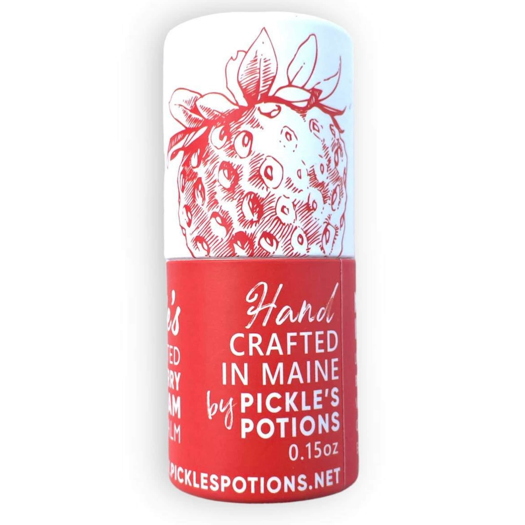 Lip balm tube with red and white strawberry illustration, red and white text, by Pickle's Potions