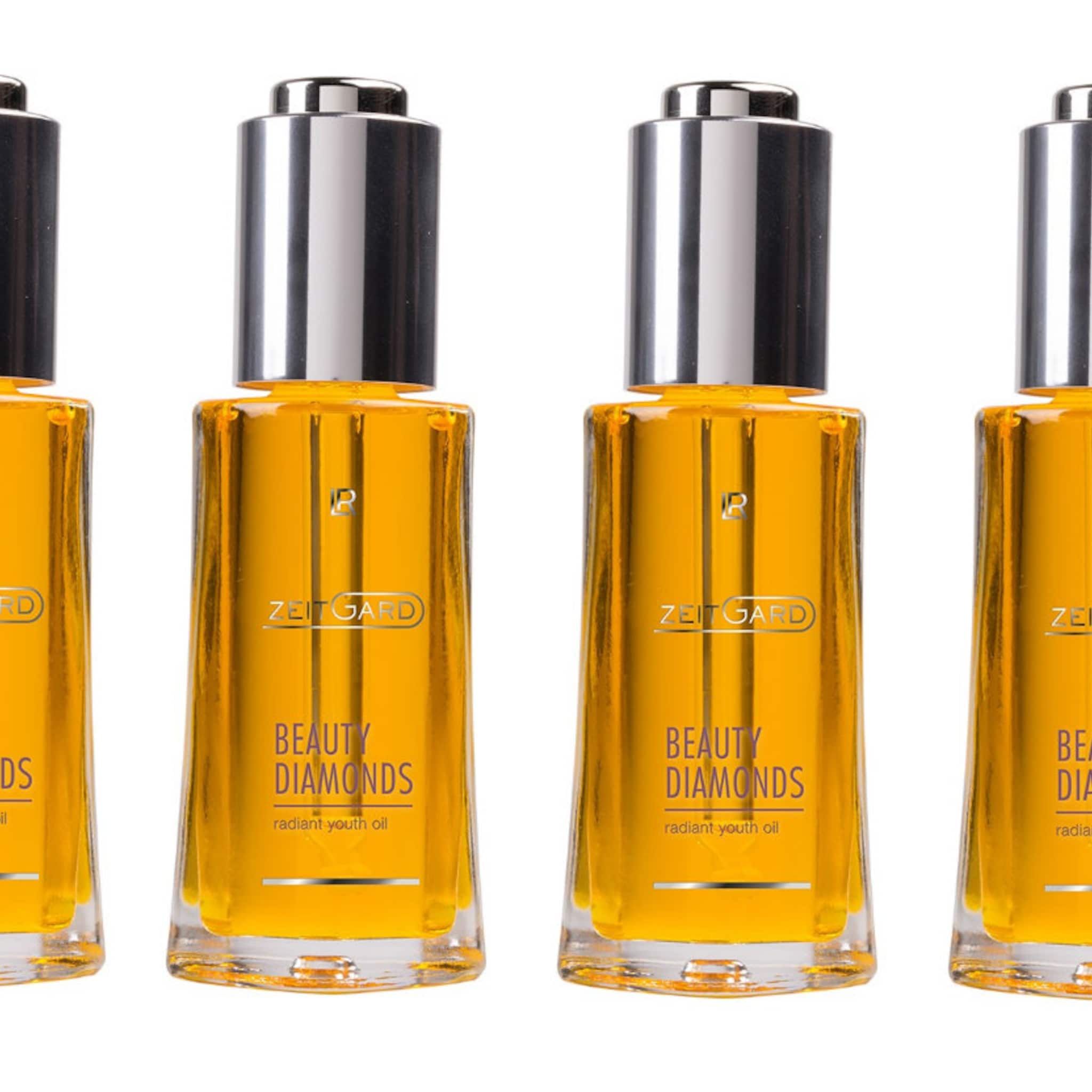 Beauty oil bottles with silver cap, clear glass, and yellow liquid, Zeitgard brand visible