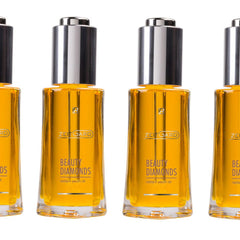 Beauty oil bottles with silver cap, clear glass, and yellow liquid, Zeitgard brand visible