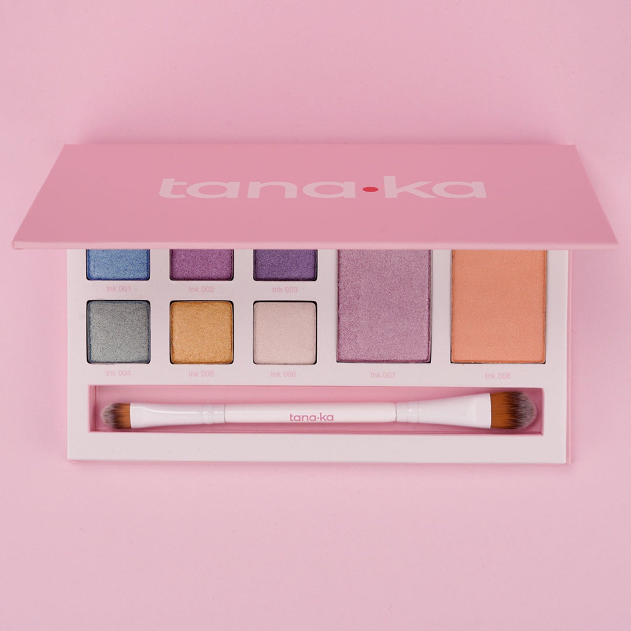 Close-up of shimmering nude and pink eye shadow palette with soft matte and glitter finishes