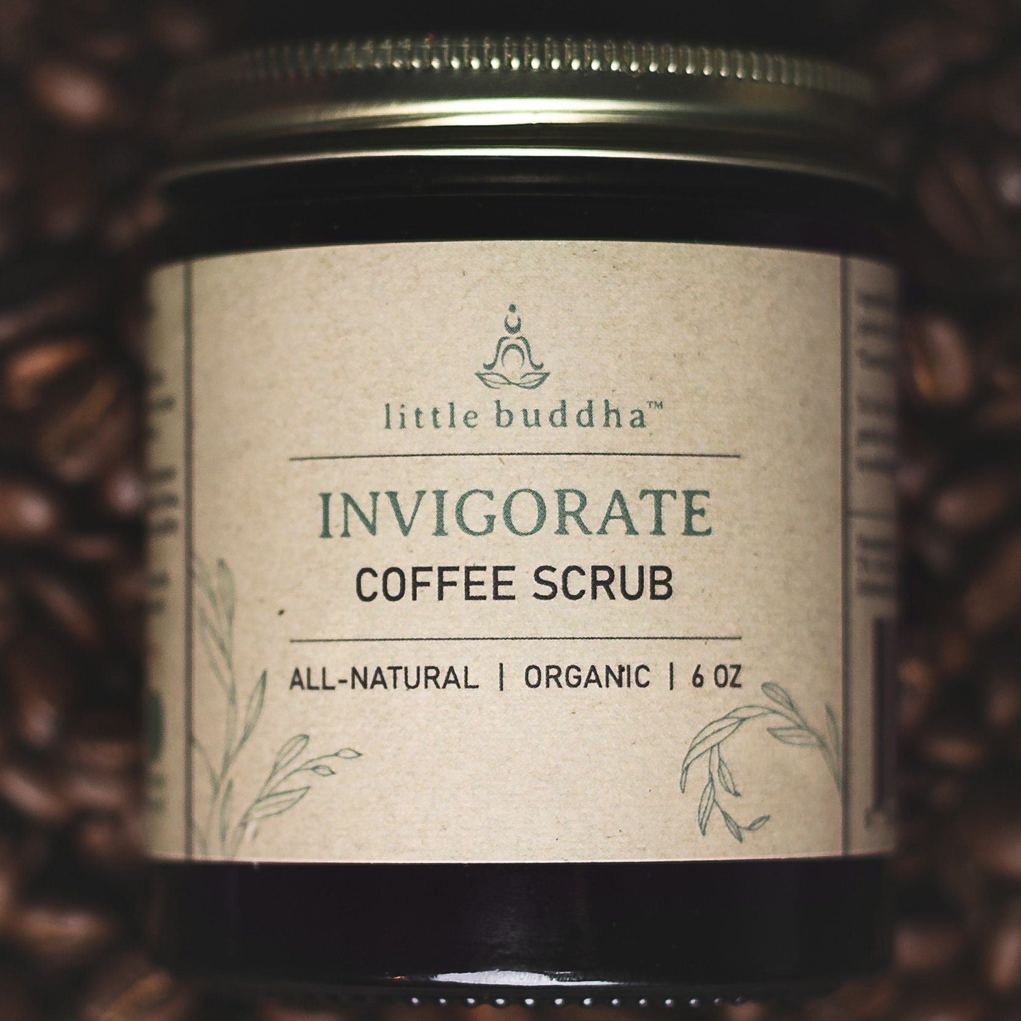 Coffee scrub jar with gold lid, brown label, and Little Buddha text