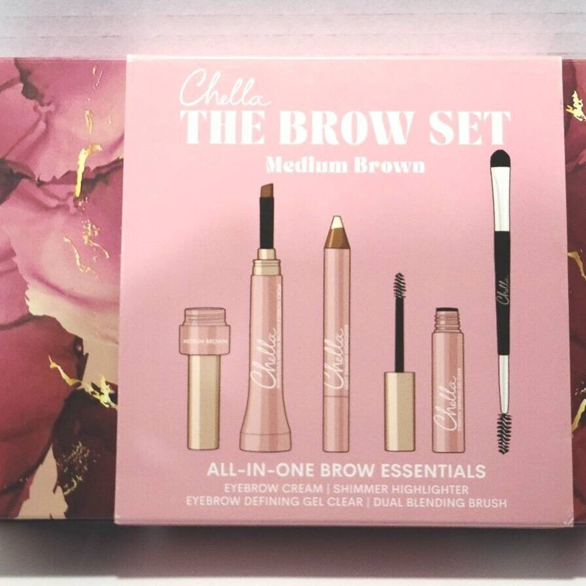 Front view of CHELLA 4-piece eyebrow cream kit in medium brown with compact case and applicator tools