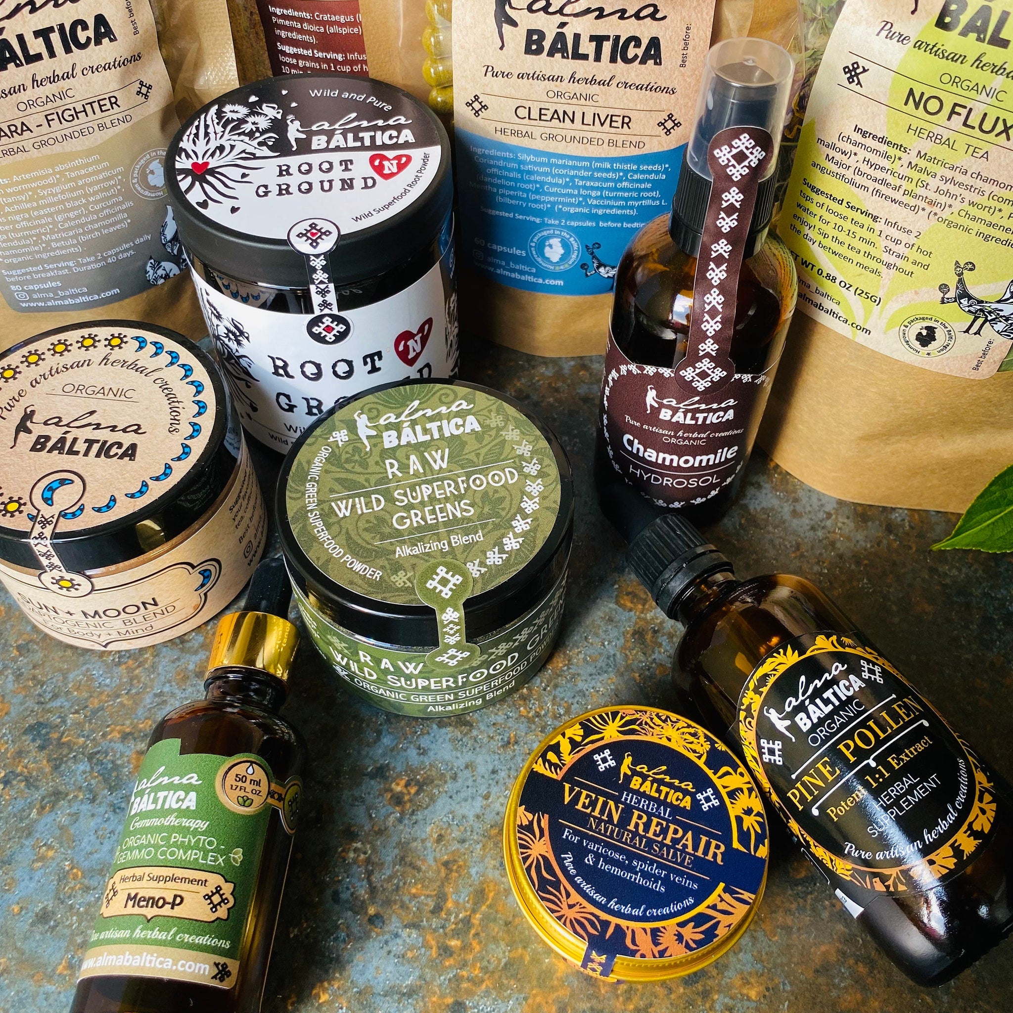 Herbal supplements with various labels and packaging on a dark surface