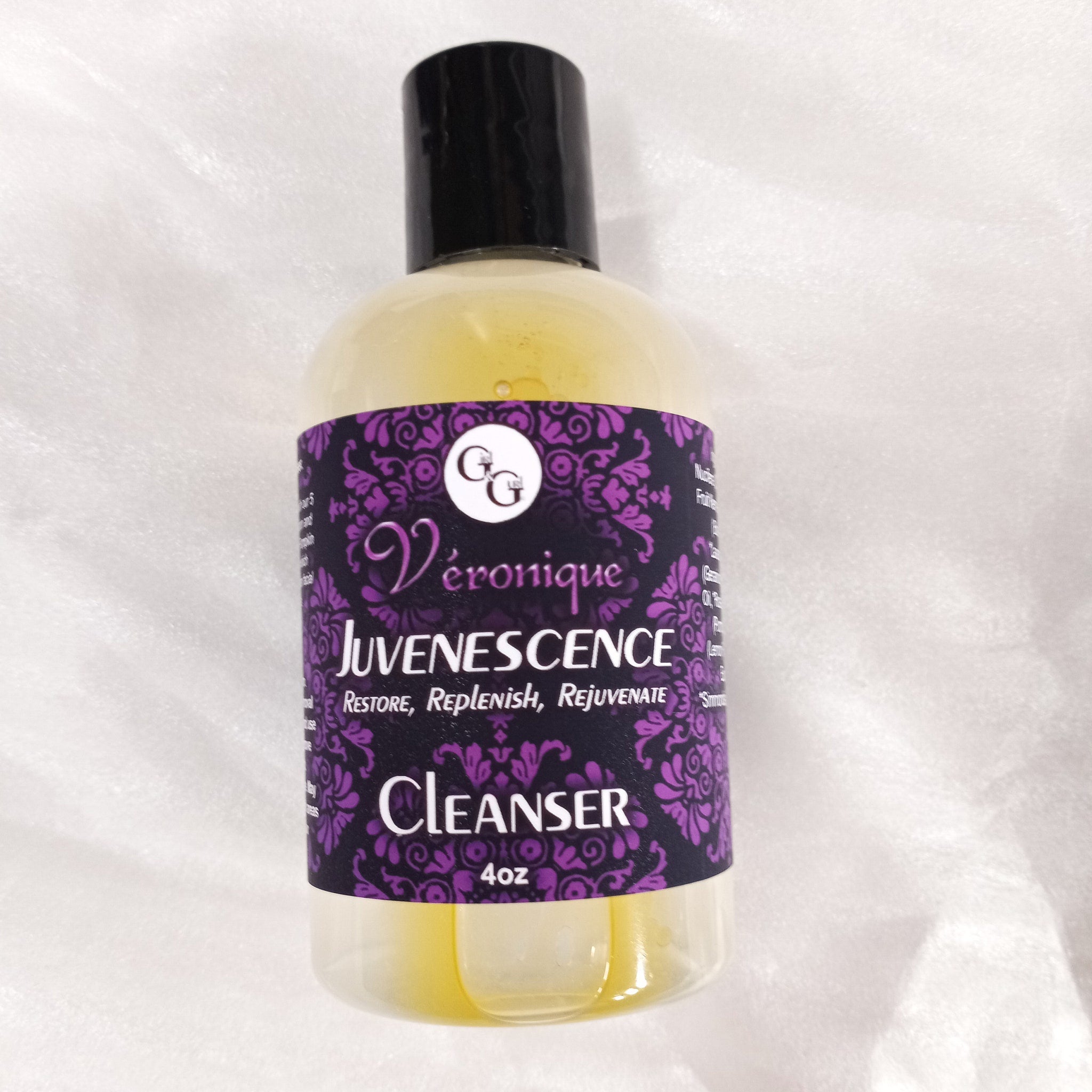 Cleanser bottle with black cap, clear liquid, and Véronique label with purple pattern