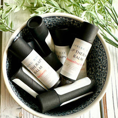 Lip Therapy Balm, black and white tubes, in a patterned bowl, Spring Day brand