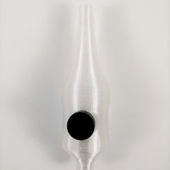 Close-up of 25mm stainless steel handpoke skincare tool with rounded tip for gentle facial treatments
