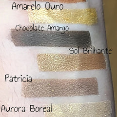 Side view of Patty Costa 12-color eyeshadow palette showing rectangular pans with matte and shimmer shades in warm neutrals