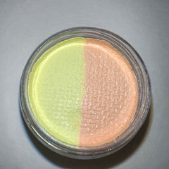 Close-up of honey-toned graphic liner eyeshadow with shimmering gold flecks in sleek black packaging
