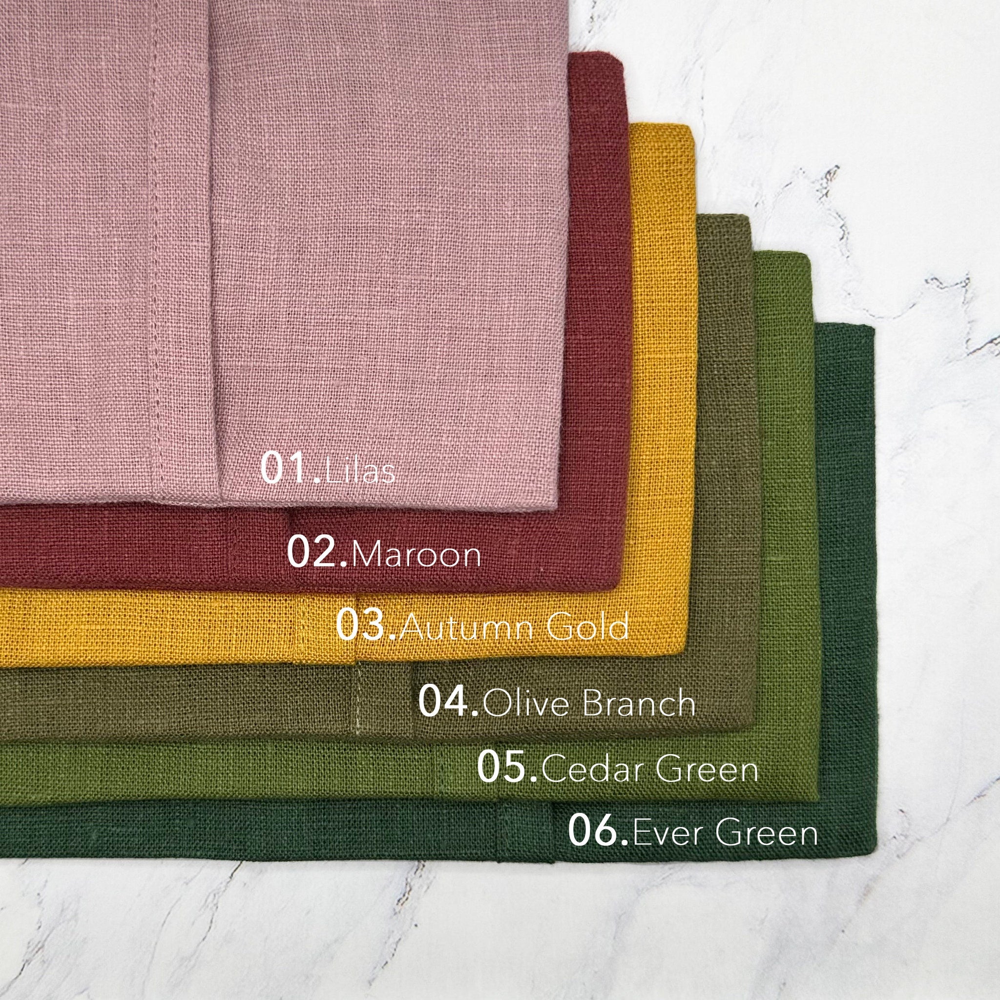 Fabric swatches in various colors, including pink, maroon, and gold, with visible linen texture and color names