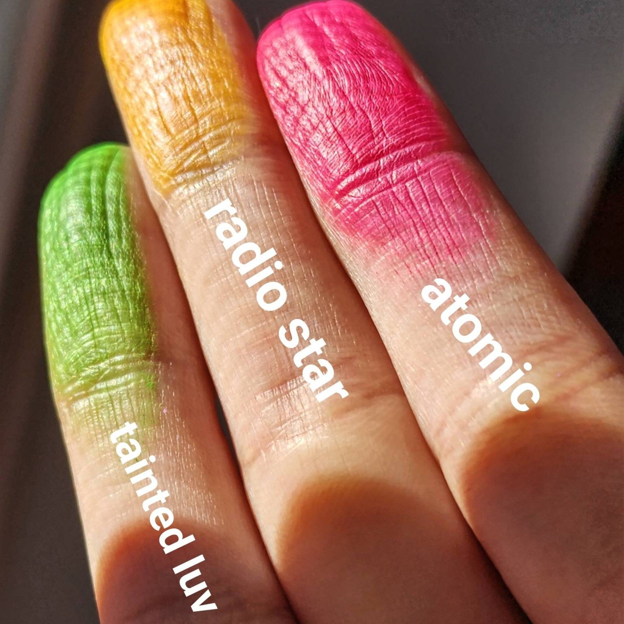 Close-up of vibrant neon yellow matte eyeshadow pan with smooth pressed texture and 80s-inspired packaging