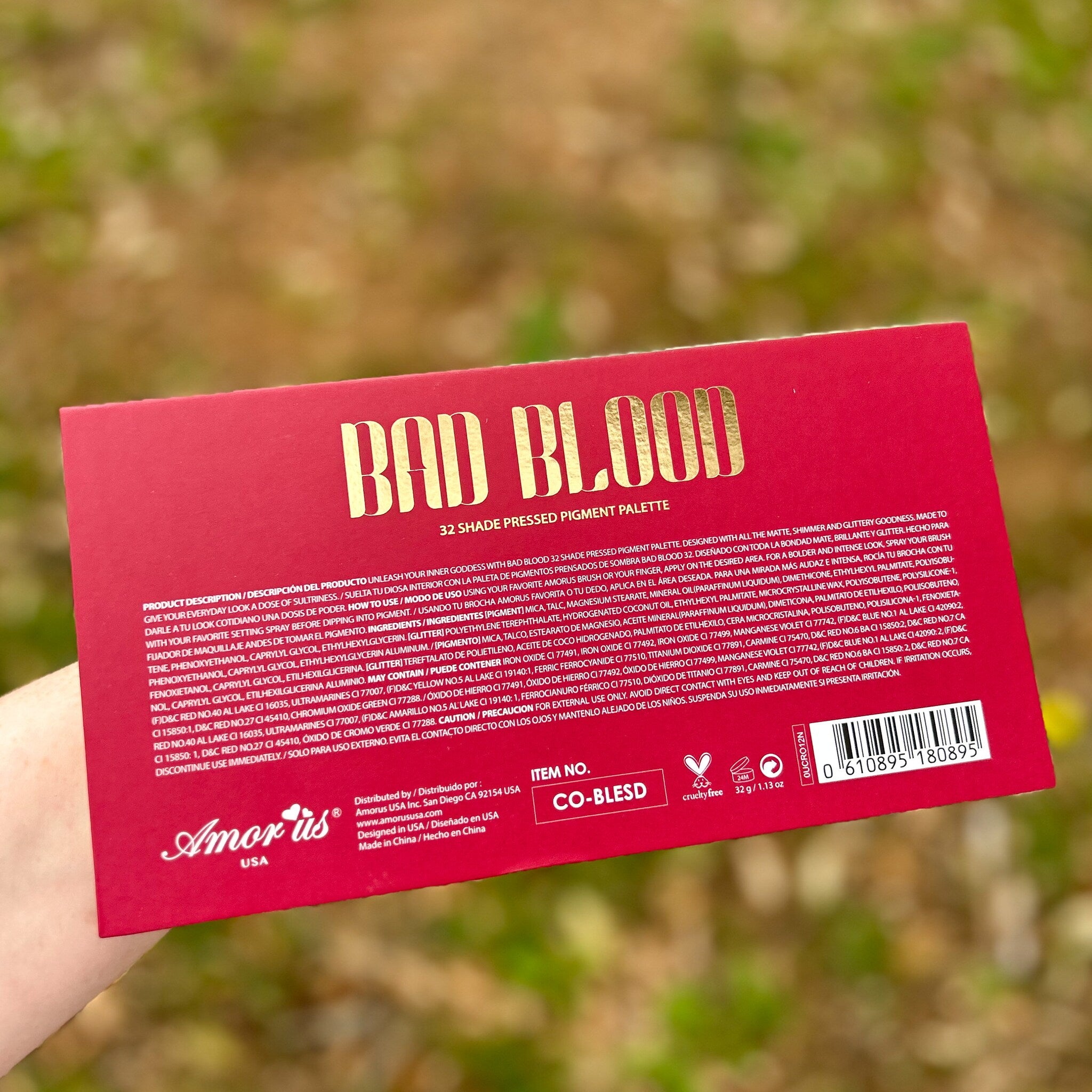 Side view of Pigmented Bad Blood Eyeshadow pot showing deep crimson powder with smooth texture and matte finish