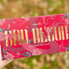 Close-up of deep crimson pigmented eyeshadow pan with smooth velvety texture and bold color payoff