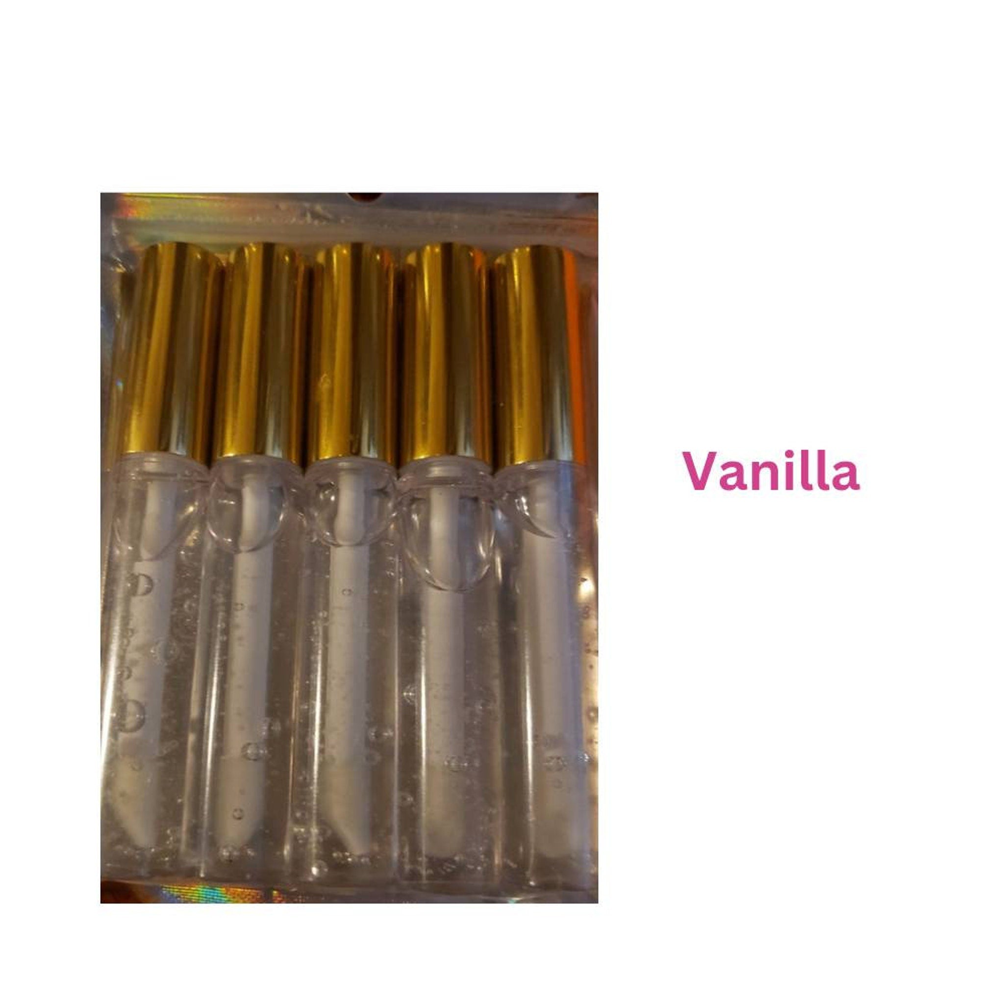 Lip gloss tubes with gold caps, clear tubes, and "Vanilla" text visible