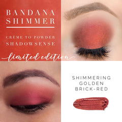 Close-up of fingertips applying creamy Bandana shade shimmer eyeshadow with smooth blending motion on eyelid