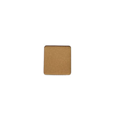 Hand applying matte taupe eyeshadow from refillable vegan pan with fingertip
