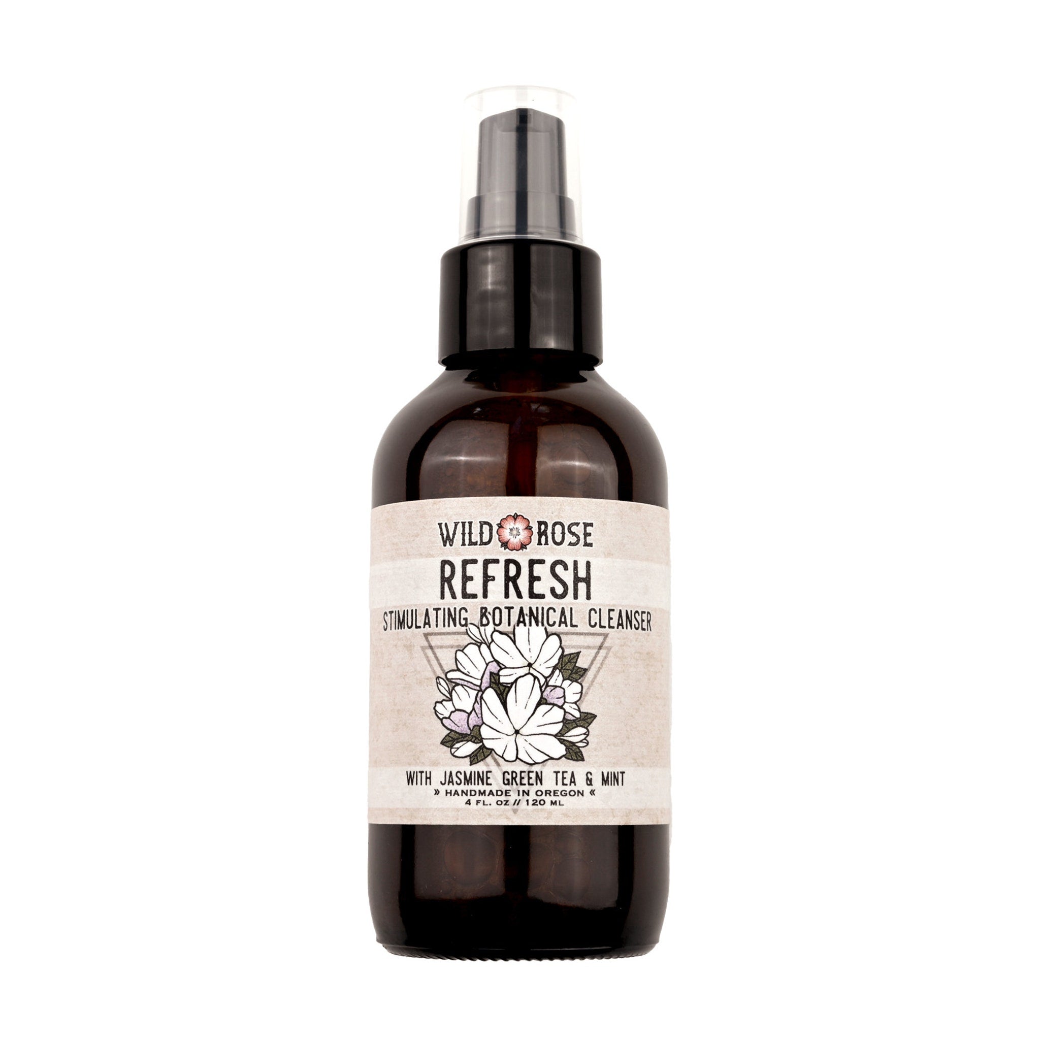 Botanical cleanser bottle, brown glass, label with Wild Rose text and floral design, pump top