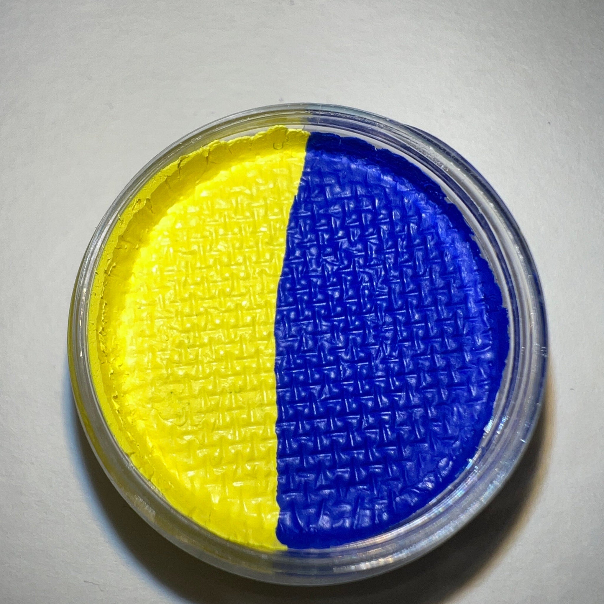 Close-up of Brazen Graphic Liner Eye Shadow pot showing vibrant pigment texture and precise angled brush applicator