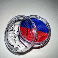 Close-up of Reckless Graphic Liner Eye Shadow pot with vibrant matte black powder and sleek silver compact