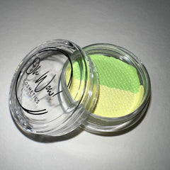 Close-up of Lime Graphic Liner Eye Shadow in vibrant green shade with sleek black packaging and pointed tip applicator