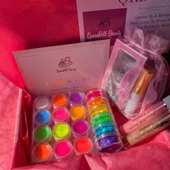 Close-up of vibrant neon pink and iridescent blue glitter eyeshadows with shimmer particles in a sleek black palette