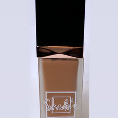 Side view of Shade-Perfect Foundation compact showing sleek black case with mirrored interior and pressed powder pan
