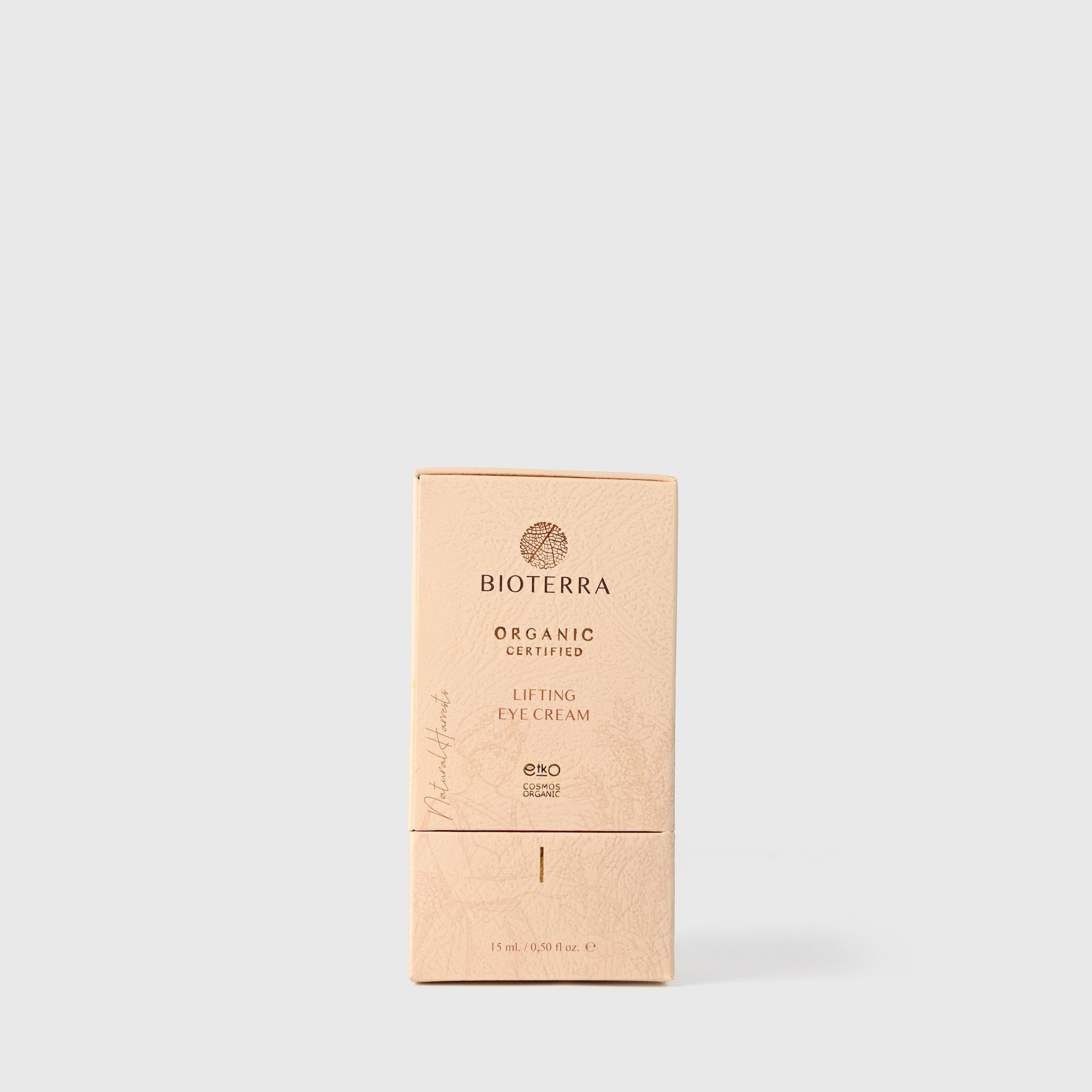 Lifting eye cream in beige box with brand name BIOTERRA, text and a leaf pattern on the front