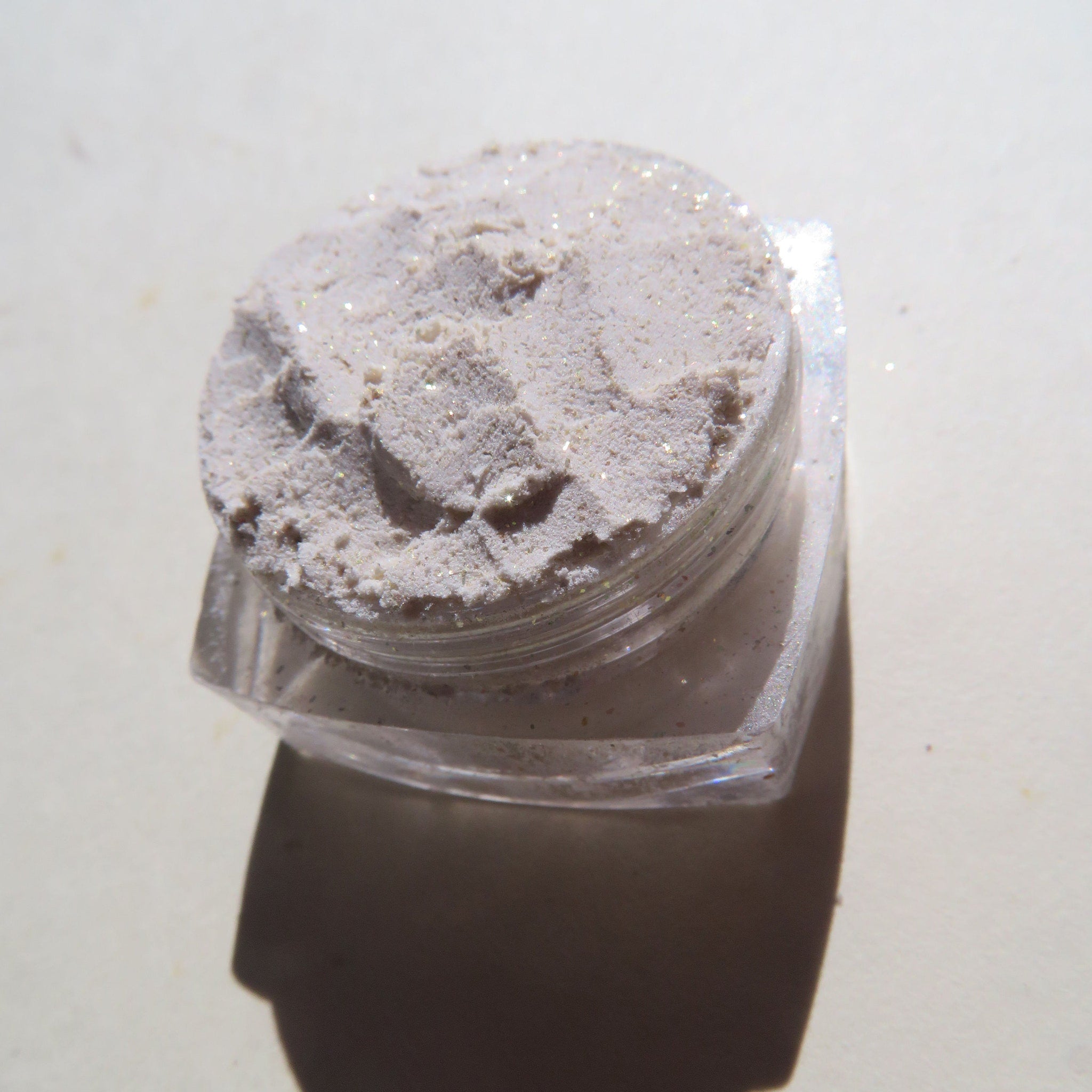 Powder eyeshadow, light beige with glitter, in clear plastic jar