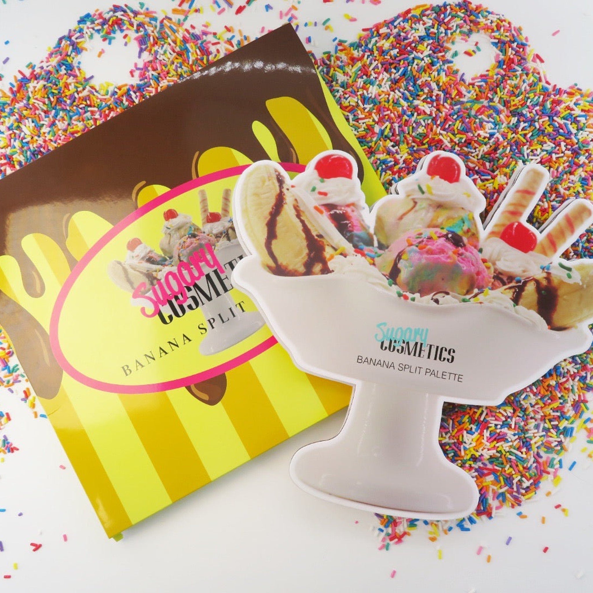 Banana Split Palette with white bowl, colorful sprinkles, and Sugary Cosmetics branding
