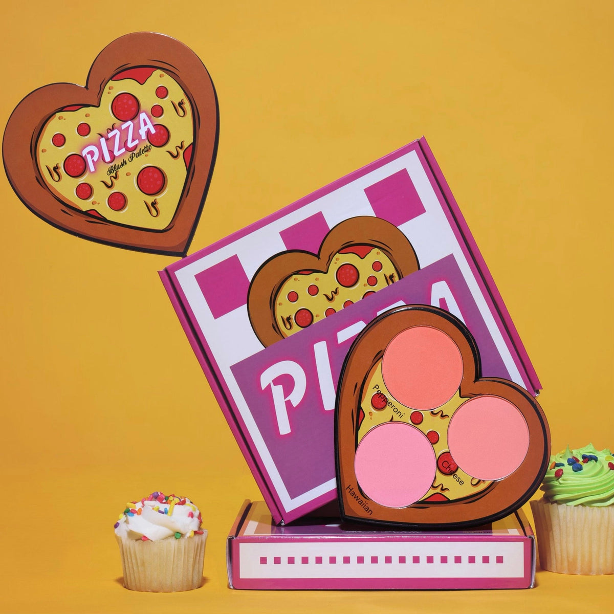 Pizza-shaped blush palette with six heart-shaped eyeshadows in warm pink and bronze shades, cruelty-free packaging