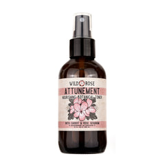 Toner bottle with brown glass, white label, and floral design, Wild Rose brand
