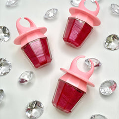 Ring Pop lip gloss in pink and red with diamond accents