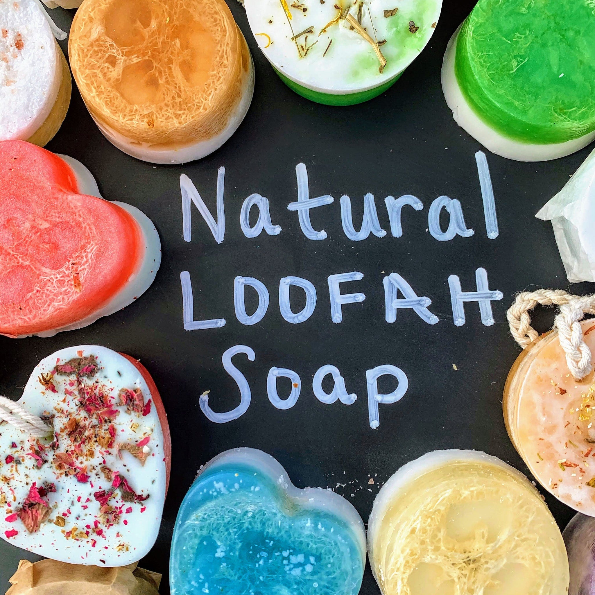 Natural Loofah Soap with various colors, shapes, and textures, including loofah and heart shapes