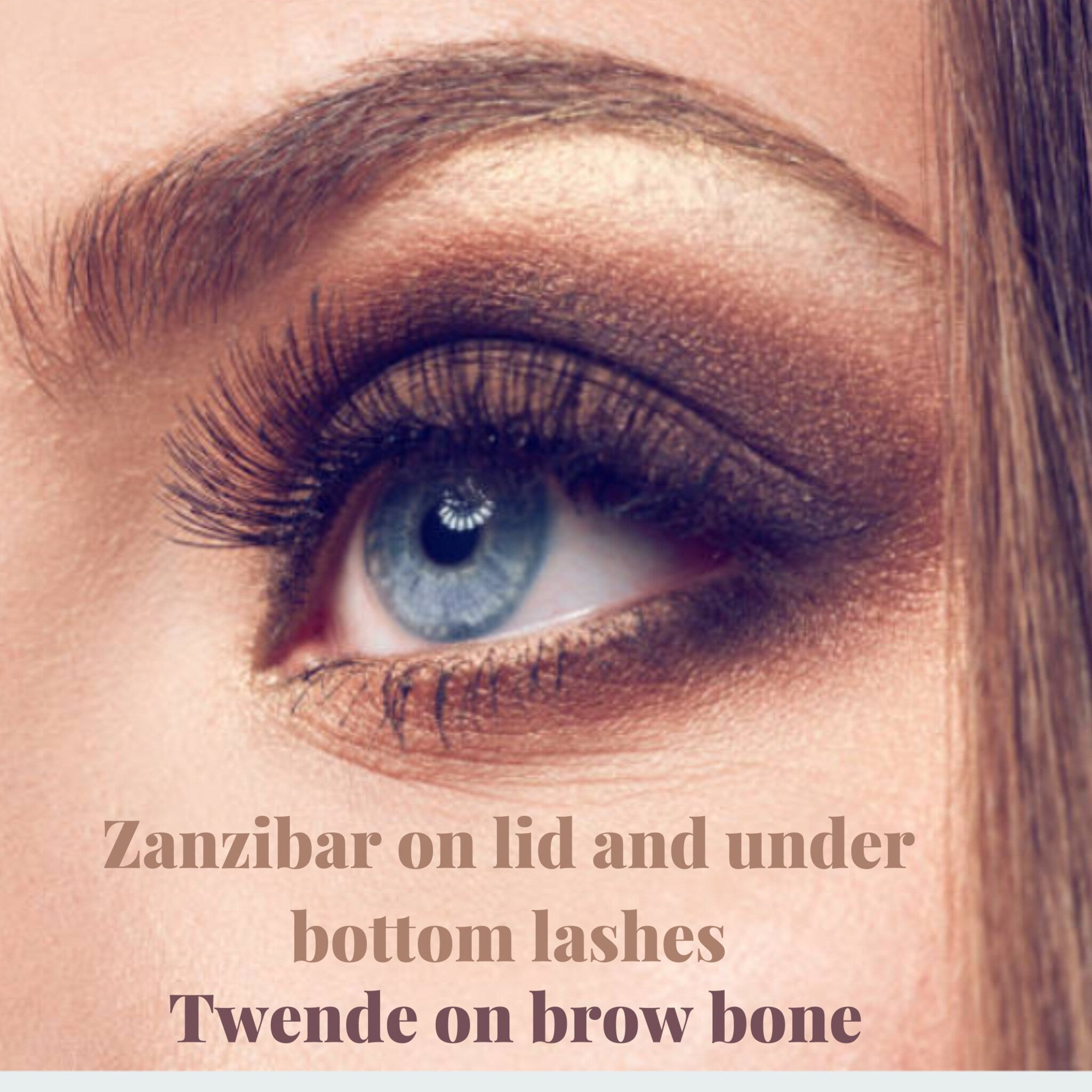 Vegan ZANZIBAR eyeshadow compact open to reveal pressed powder pan with mirror inside.