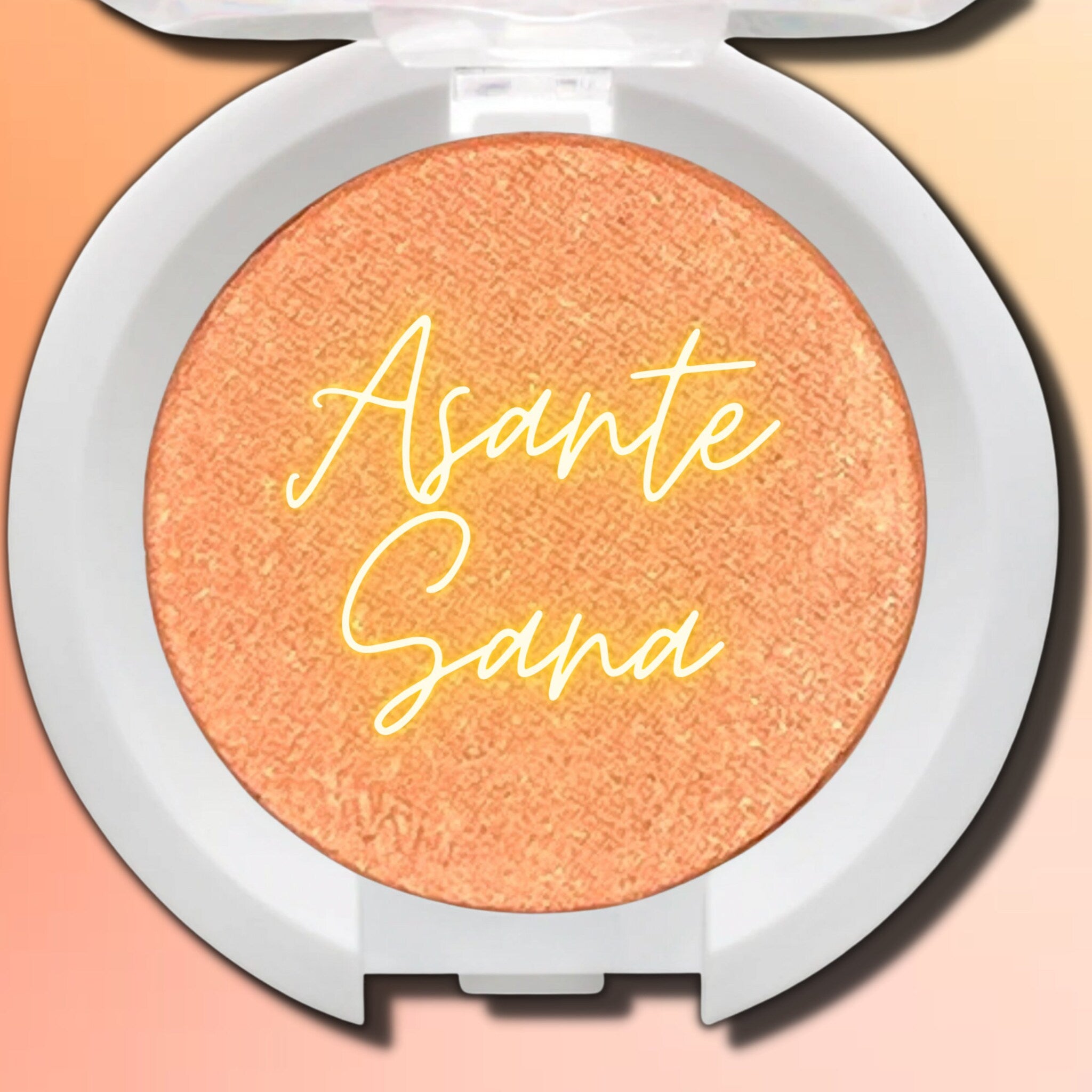 Hand applying shimmery taupe vegan eyeshadow with fingertip onto eyelid