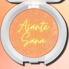 Hand applying shimmery taupe vegan eyeshadow with fingertip onto eyelid